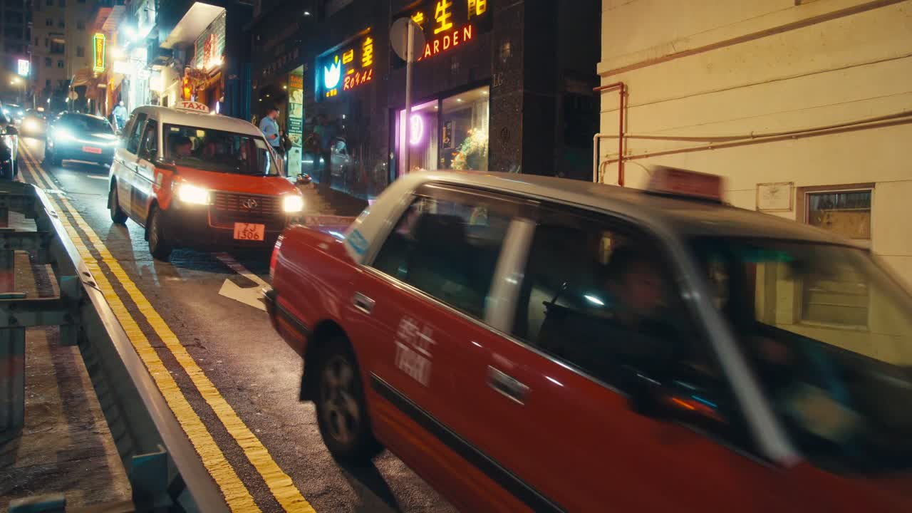Hong Kong Taxi Driving Through Neon Streets at Night