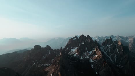 Beautiful-aerial-alpine-mountain-top-range-landscape,-dramatic-steep-snowy-peaks,-famous-south-tyrol