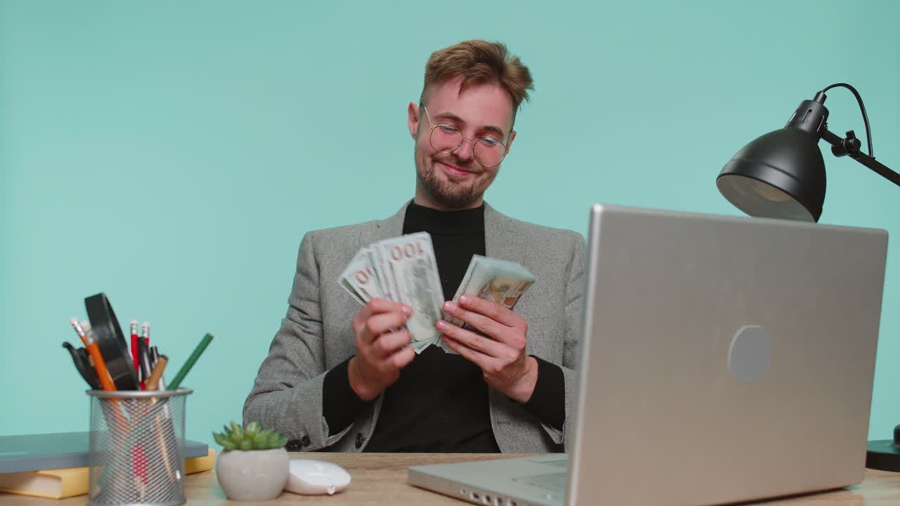 Rich happy business man satisfied of income earnings counting money dollar cash dancing celebrate