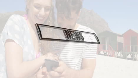 on beach, couple looking at smartphone with animation of news text overlay