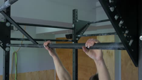 People Doing Pull-ups in Gym
