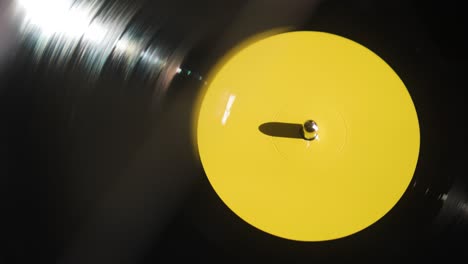 vinyl spinning on a record player - high angle shot