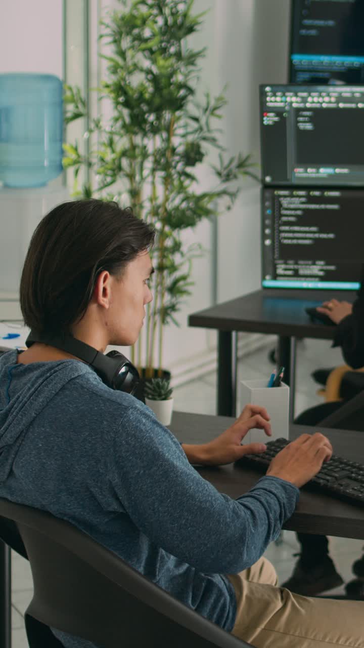 Vertical video: Asian software engineer working on security program with server code