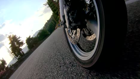 motorcycle front tyre view rolling fast into turn