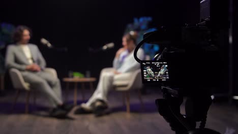 camera view of a studio interview or talk show