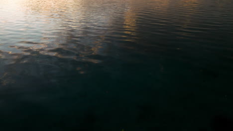 Sunrise-Scenery-Of-The-Ocean-With-Couple-On-Paddle-Board-And-Kayak-In-Moso-Island,-Vanuatu---Drone-Shot