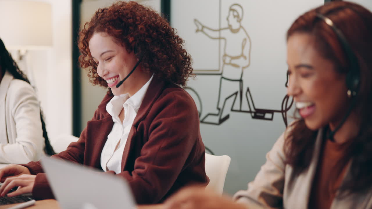 Smiling customer service representatives working in an office