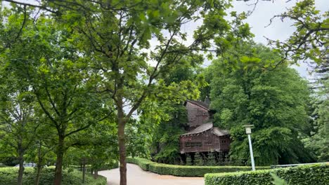 a wooden house nestled amongst greenery