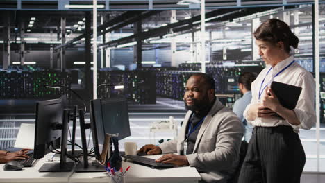 Vertical video Lead data center technician overseeing team integrating AI automation in rigs