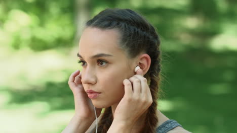 fit girl exercising with music