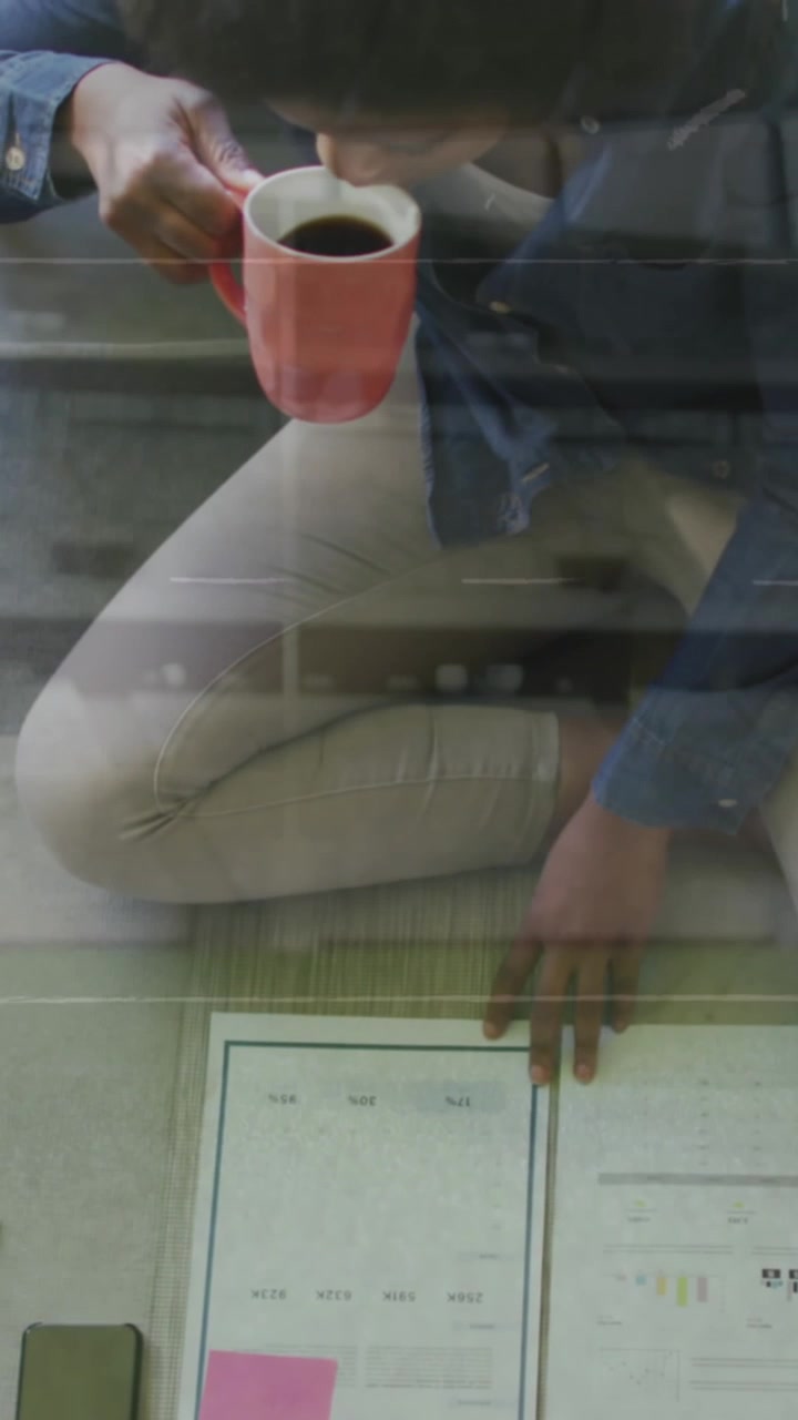 Animation of strategy plan over african american woman studying