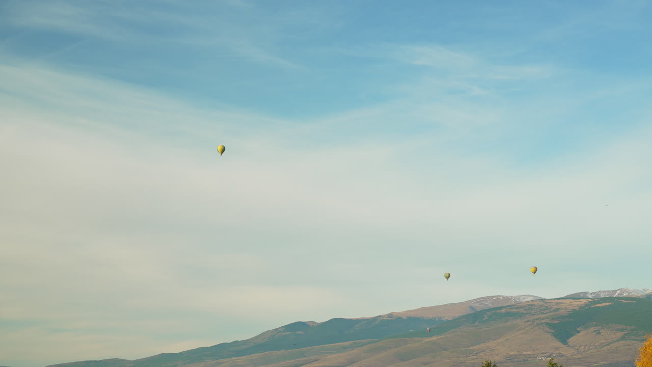 Hot air balloons soar against majestic backdrop of Pyr&eacute;n&eacute;es mountains