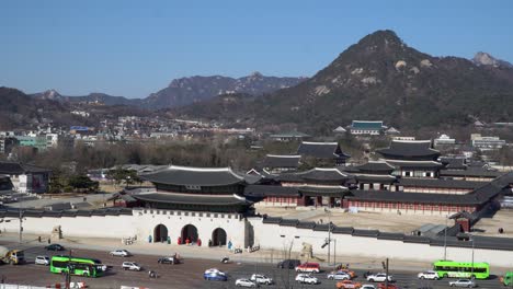 Aerial-view-of-Gwanghwamun-Gyeongbokgung-Palace-with-a-mountain-Bugaksan-in-Seoul,-Seoul-Korea