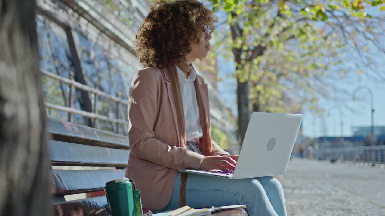 Businesswoman Working on Laptop Outdoors and Enjoying Beautiful Day