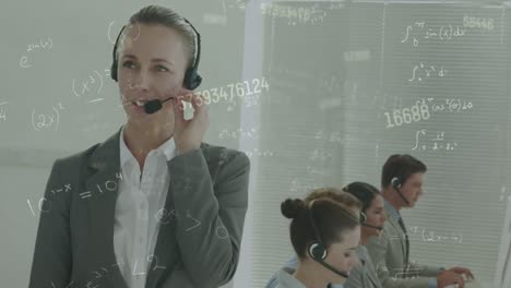 Animation-of-numbers-over-business-people-using-phone-headsets