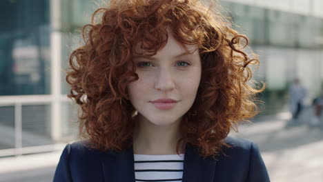 young successful business woman portrait of smiling confident red head