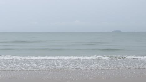 rayong beach while rain and strong waves in the rainy season. cloudy rainy weather with strong wind