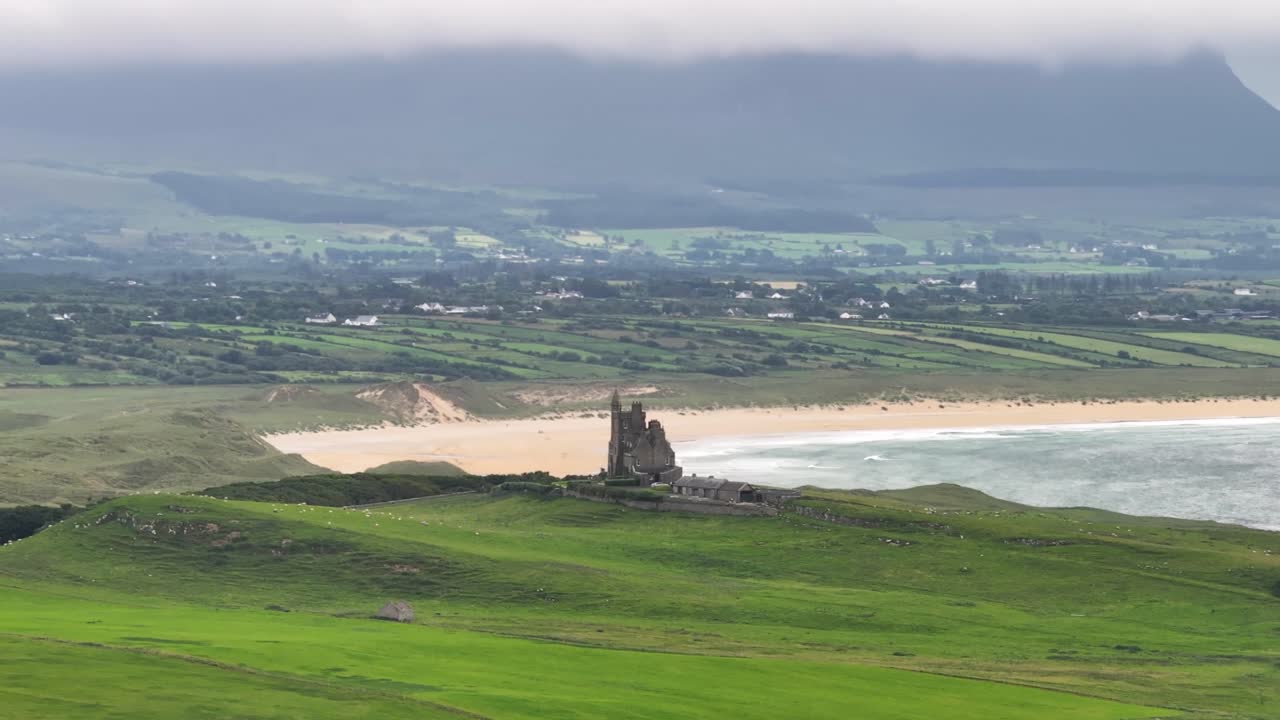 Classiebawn Castle in Mullaghmore, Co. Sligo. With sandy beach and mountain. Ireland drone