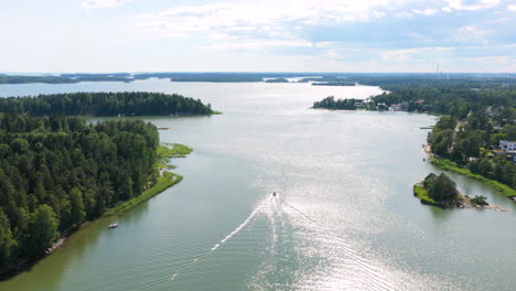 drone tracking a boats in the finnish archipelago, sunny, summer day in finland