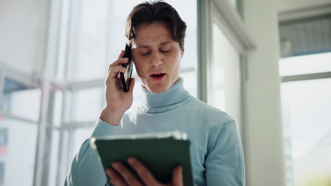 Man using phone and tablet
