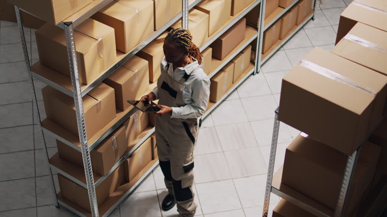 Warehouse workers checking inventory with tablet