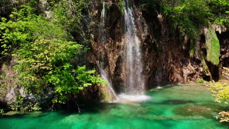 waterfalls with clear water in plitvice national park, croatia - aerial takeoff