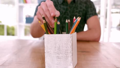 casual business team taking pencils