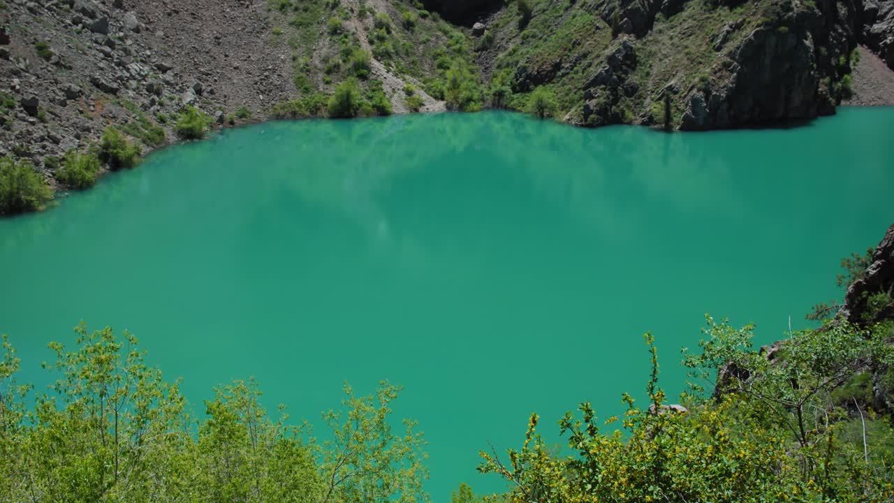 Mountain Lake of green and blue color Urungach. Some pine trees. Located in Uzbekistan, Central Asia. 13 out of 20  Tyanshan mountains