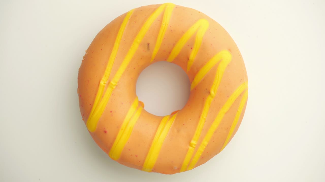 el donut está vidriado de cerca, con un bucle sin costuras.