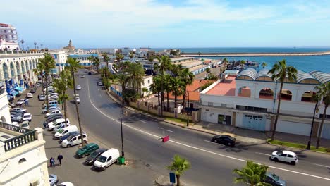 road to the sea front of algiers the capital of algeria with the port in the background