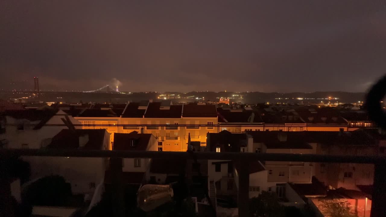 Night Cityscape with Illuminated Buildings and Bridge