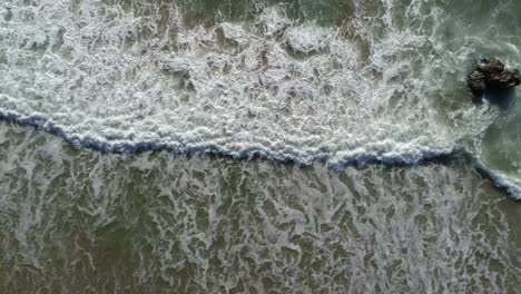 Aerial-Sandy-Tropical-Beach-and-Sea-Green-Sea-Waves-Aerial-View