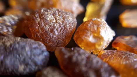 natural baltic amber stones on a black background-2