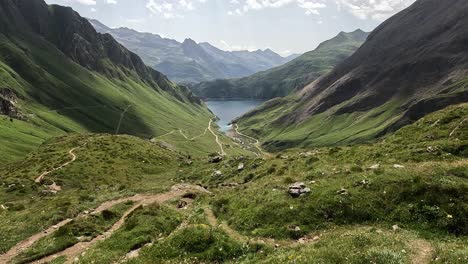 beautiful green mountain valley showing lago di morasco and its surrounding mountain landscape