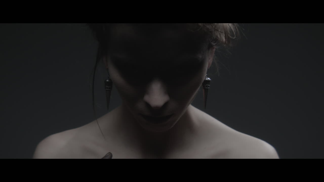 A woman dressed as mother nature rise her head