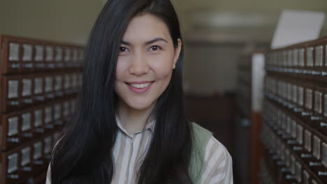 woman smiling in a library