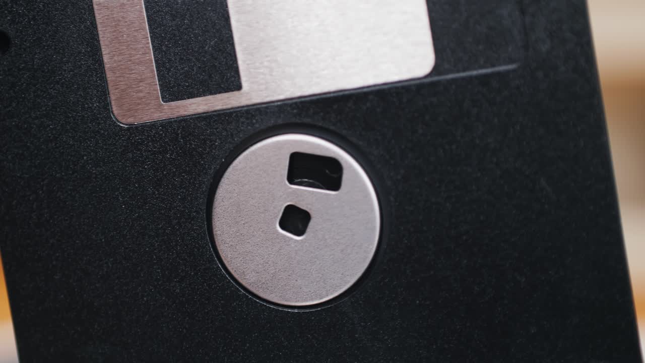 Using diskette for old computer. Music recorder, playing retro computer games. Vintage device for office, obsolete technology. . High quality 4k footage