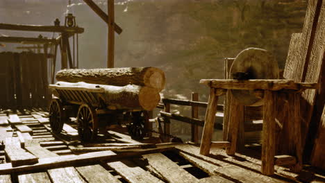 old wooden cart with logs in a rustic workshop