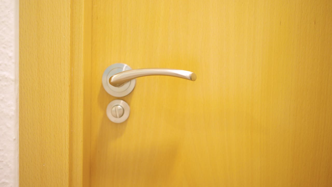 Man opening and closing bathroom door