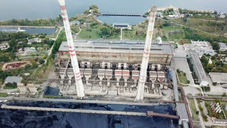 aerial view of thermal power station. combined modern power plant for urban district heating and power generation. industrial zone from above.