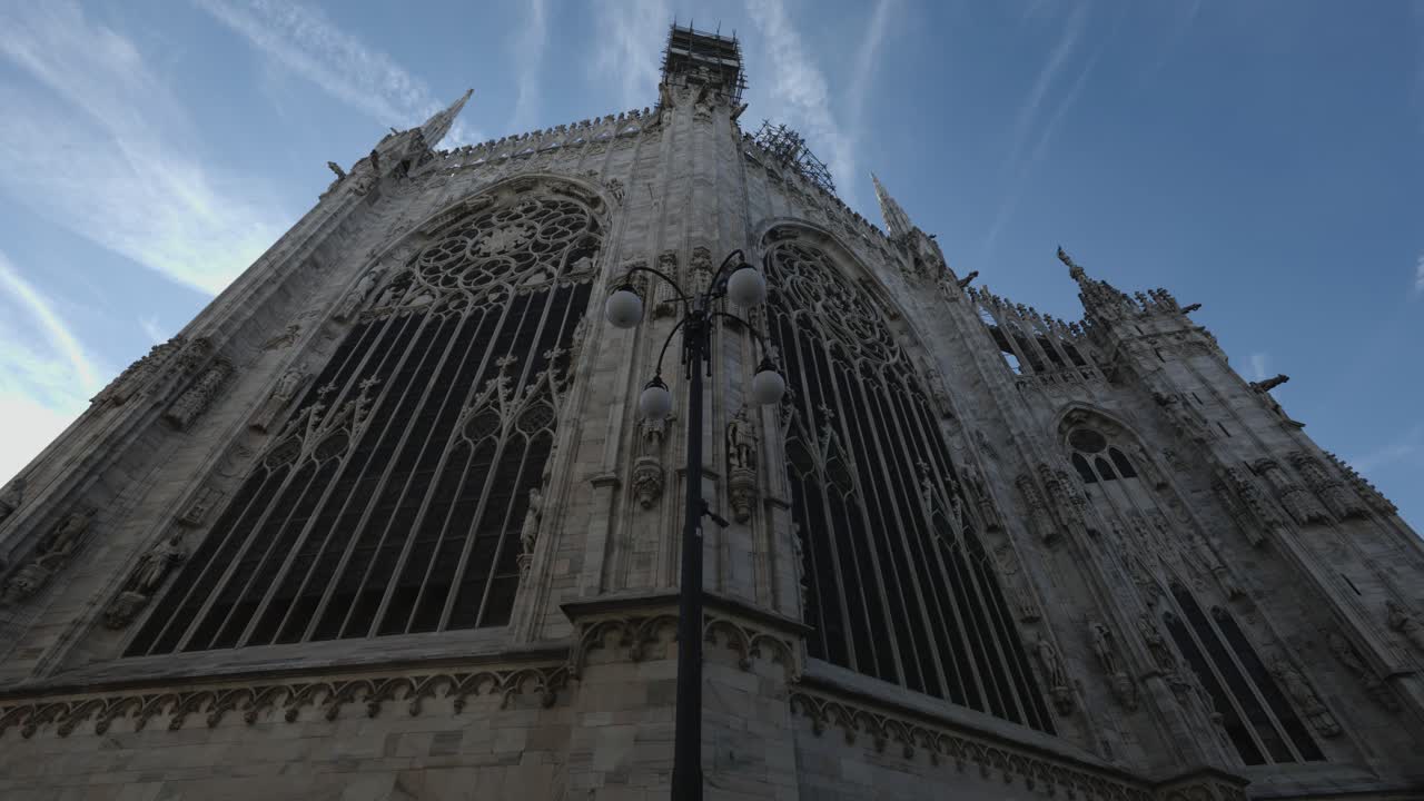 Moving sideways with view of Milan Cathedral in Italy