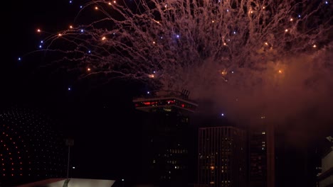 colourful pyrotechnic fireworks and aerial drone show celebration event in urban city