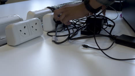 unplugging electronic devices from electricity socket, power saving concept