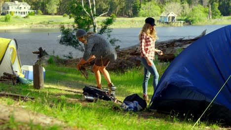 couple camping in the forest on a sunny day 4k