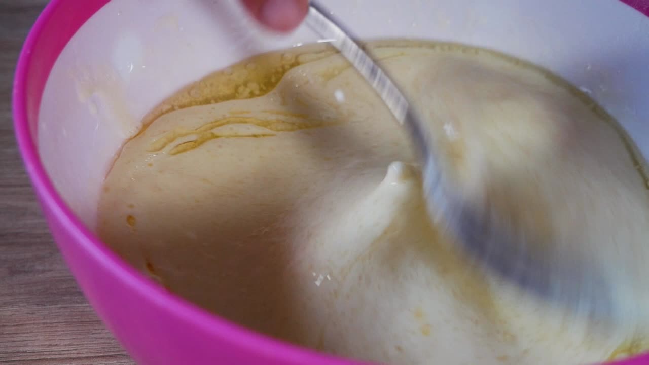 Mixing dough for american pancakes in close up homemade shot