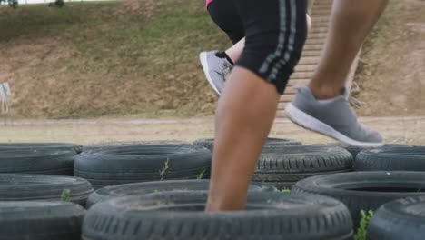 female friends enjoying exercising at boot camp together