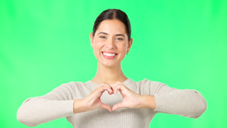 Heart,-hands-and-face-of-happy-woman-on-green