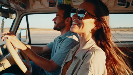 a happy couple enjoying a road trip in a vintage van with the wind in their hair