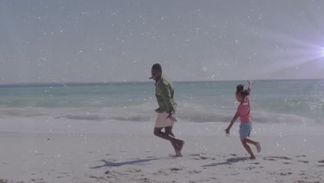 Animación-De-Estelas-De-Luz-Sobre-Un-Hombre-Afroamericano-Y-Su-Hija-En-La-Playa