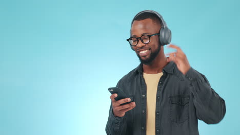 Black-man,-headphones-and-dancing-studio